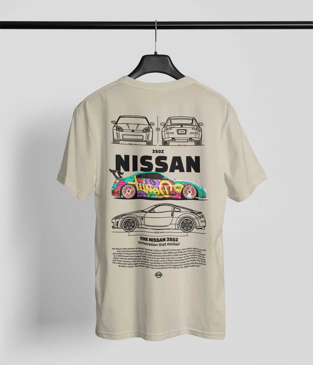 Beige t-shirt with Nissan car graphics on a hanger against a light gray background