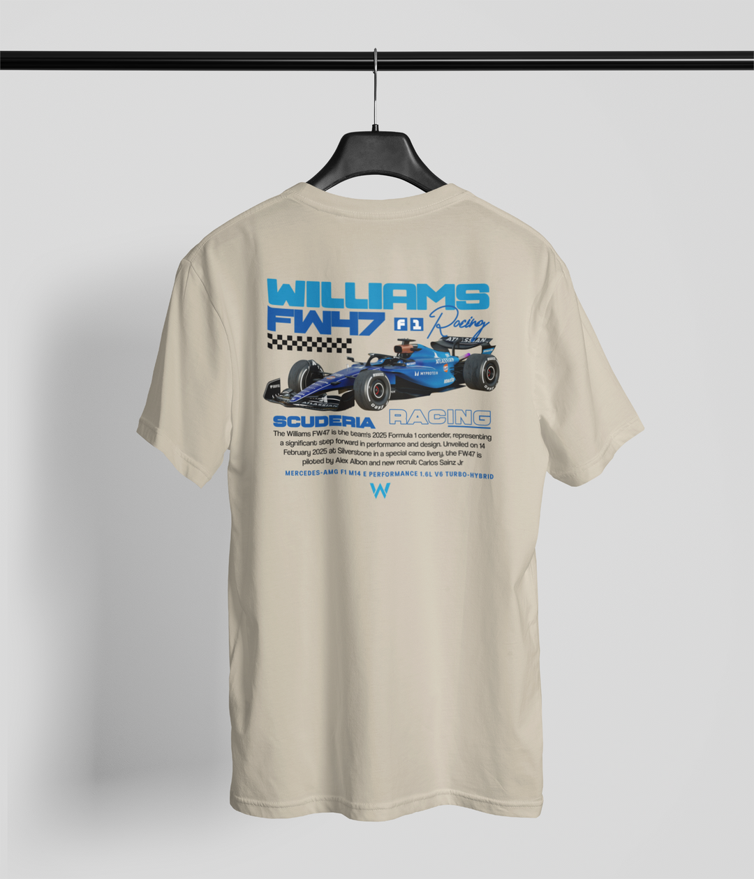 Beige t-shirt with Williams F1 racing graphic on a hanger against a gray background