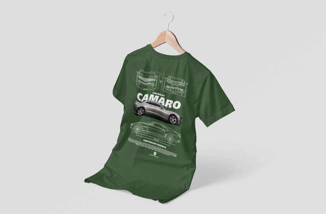 Green t-shirt with Camaro design on a hanger against a white background