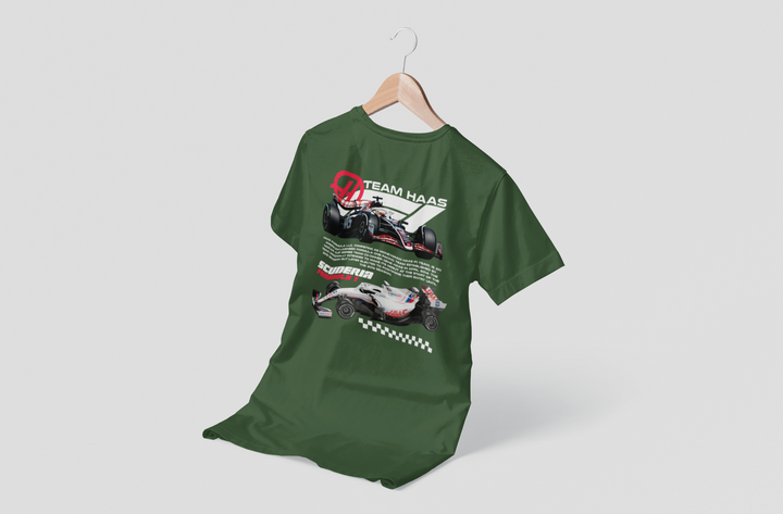 Green t-shirt with racing car design on a hanger against a white background