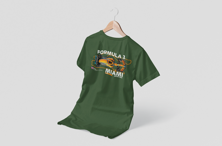 Green t-shirt with Formula 1 Miami graphic on a hanger against a white background