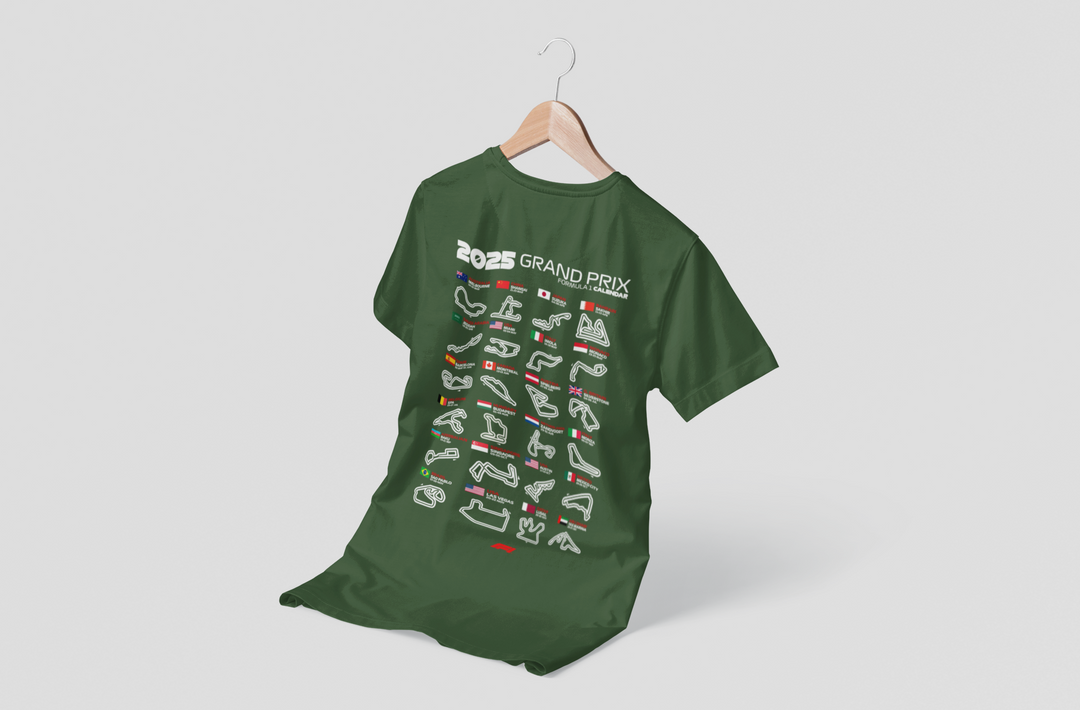 Green t-shirt with white graphic design on a hanger against a light gray background