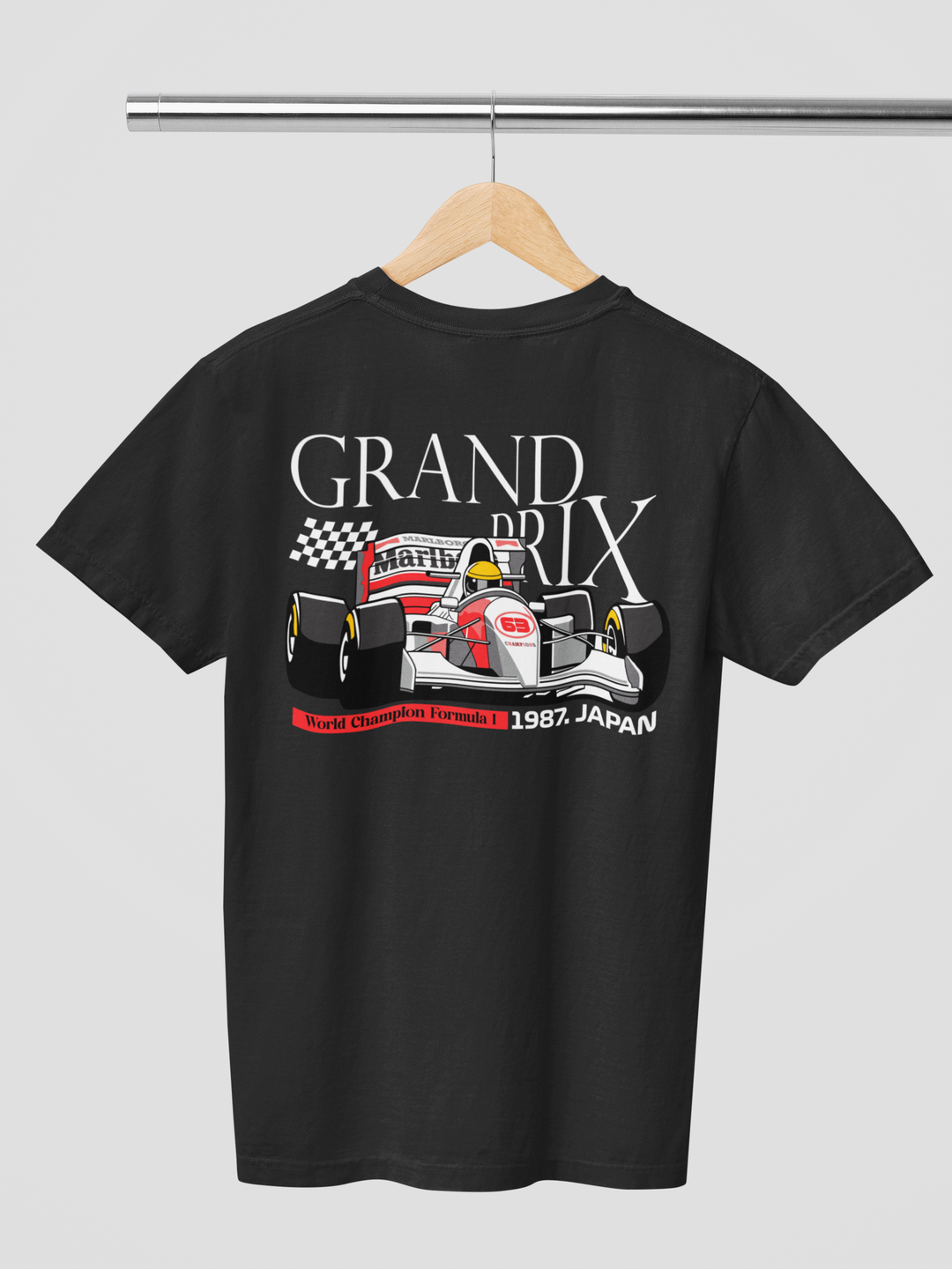 Black t-shirt with Formula 1 graphic and text on a hanger against a gray background