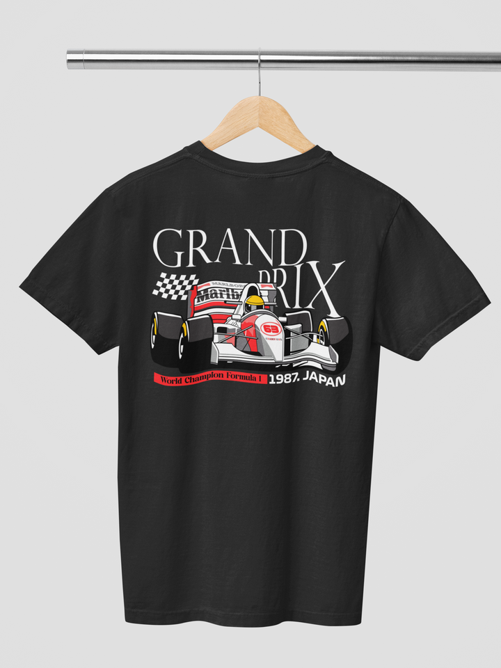 Black t-shirt with Formula 1 graphic and text on a hanger against a gray background