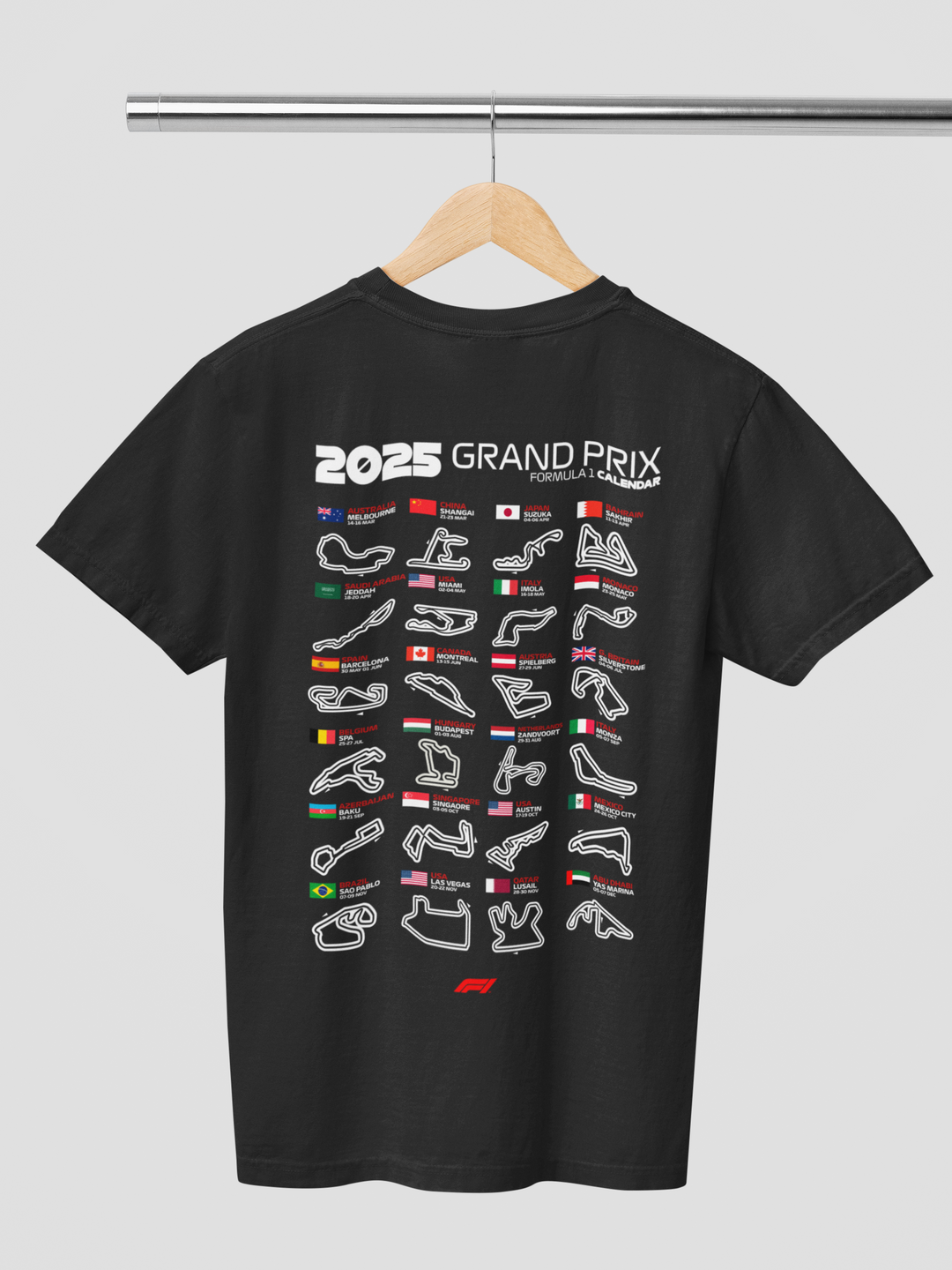 Black t-shirt with 2025 Grand Prix graphic on a hanger against a gray background