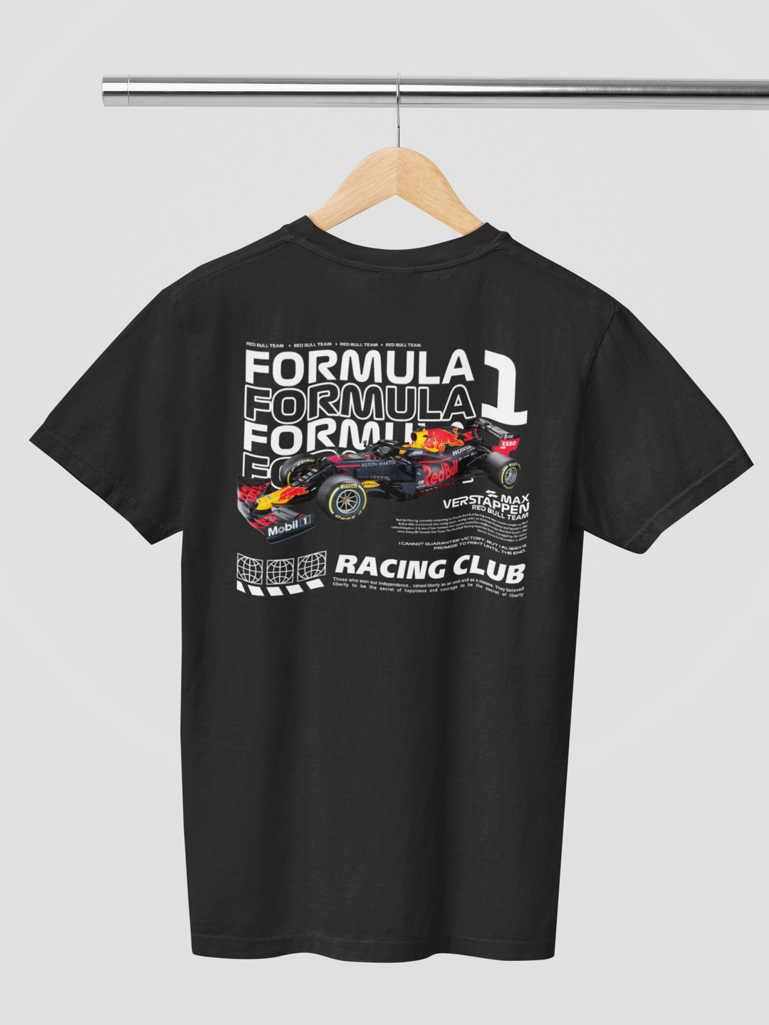 Black t-shirt with Formula 1 graphic on a hanger against a gray background