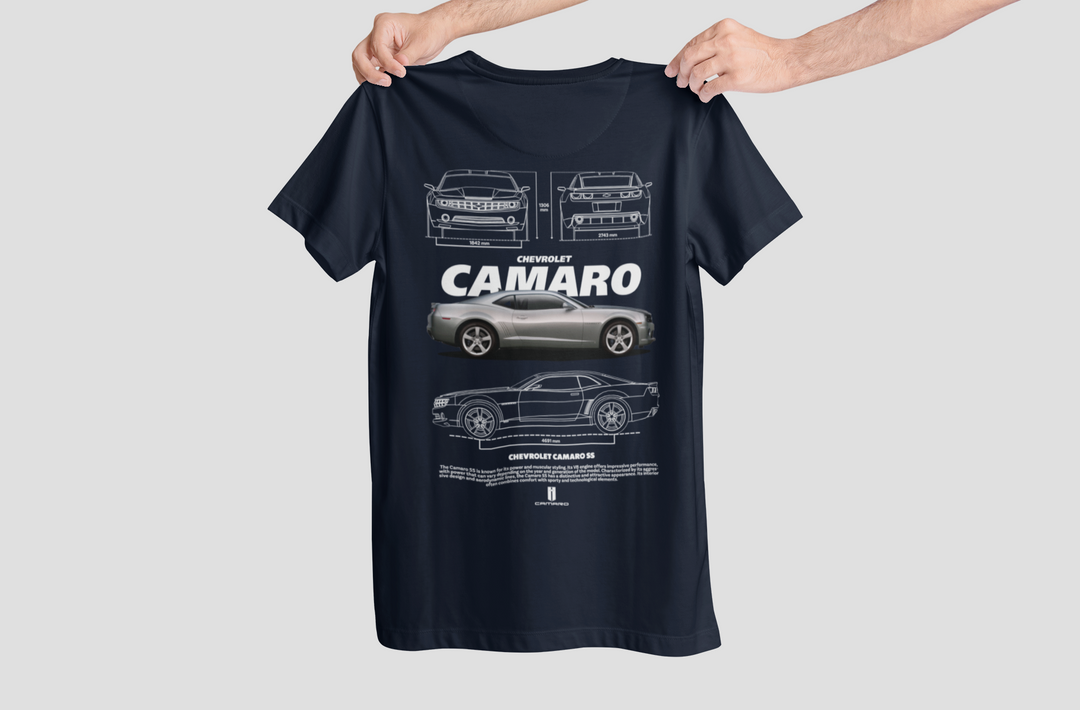 Black t-shirt with Chevrolet Camaro design held by a person on a light gray background