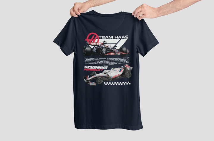 Black t-shirt with Formula 1 car design held by a person on a light gray background